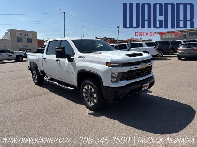 2026 Chevrolet Silverado 2500 HD Custom in Summit White — front three-quarter view