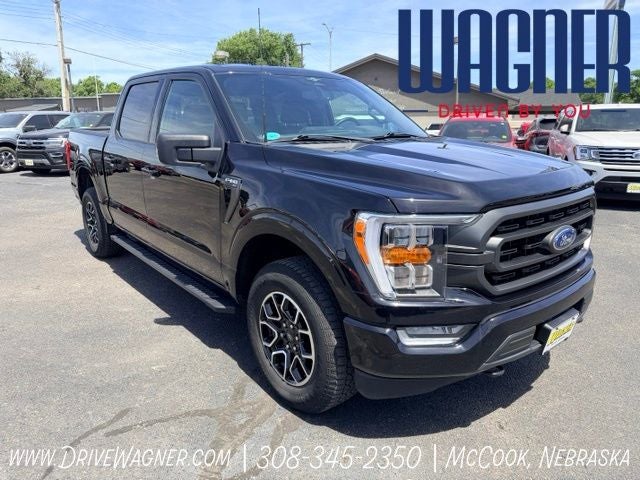 2023 Ford F-150 XLT in Agate Black Metallic — front three-quarter view