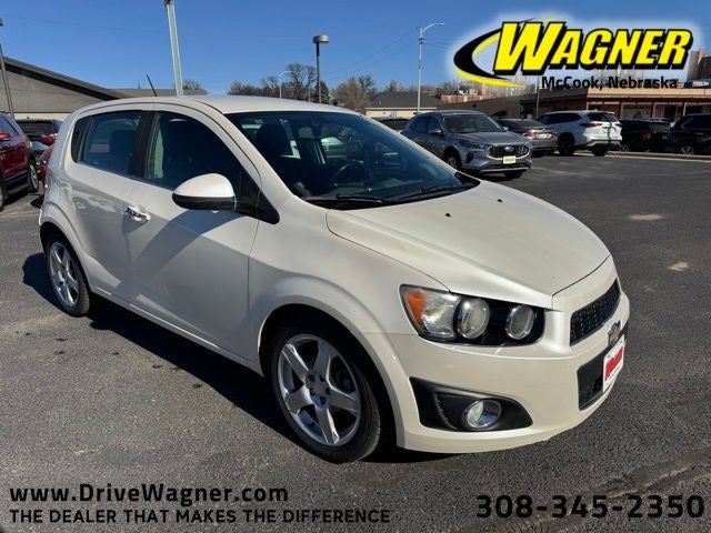 2015 Chevrolet Sonic LTZ in Summit White — front three-quarter view